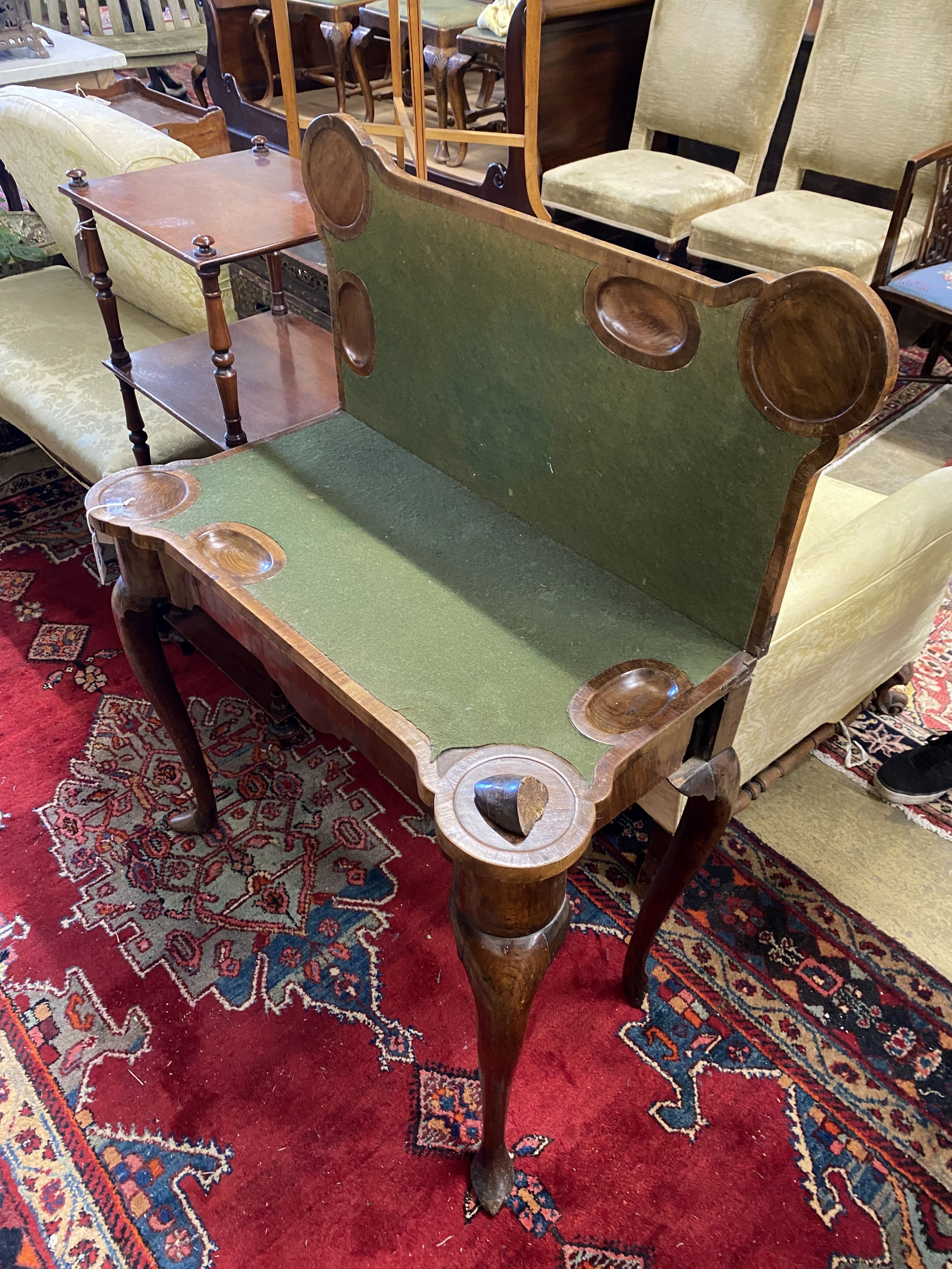 A mid 18th century walnut folding card table (a.f.), width 86cm, depth 42cm, height 73cm